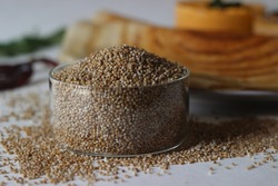 Kodo millet, also known as cow grass, rice grass, Native Paspalum, or Indian Crown Grass is an annual grain used for cooking in many parts of the world. Shot with pancakes in the background.