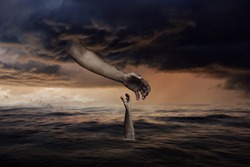 God Hand from Sky is Reaching Towards Man Hand that is Sinking Down in Ocean-Christian concept