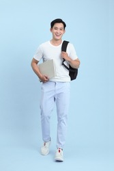 Asian handsome and cheerful young student man, isolated on background
