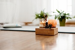 Close-up of a set of bamboo mats, incense and meditation candles