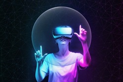 Metaverse and 3D simulation. Portrait of young woman in VR glasses creates mesh sphere. Dark background with neon abstracts. The concept of virtual reality and futurism.
