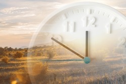 Landscape and close up of clock. Double exposure. Daylight Savings Time Concept.