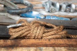 A knot of rope which is using in the industrial. Working tool equipment object photo. Close-up and selective focus.