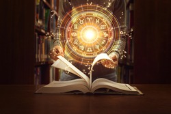 Woman reading a astrology book. Astrological wheel projection, choose a zodiac sign. Trust horoscope future predictions, consulting stars. Power of universe, astrology esoteric concept.
