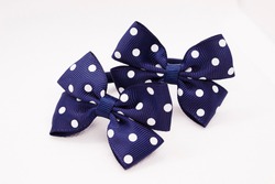 Children's hair accessories. Blue bow with white peas