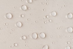 background texture beige fabric with water drops close up