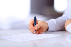 Businessman is signing a contract, business contract details