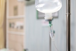Saline bag intravenous drip hospital room,Medical Concept, treatment patient emergency and injection drug infusion care chemotherapy concept. selective focus
