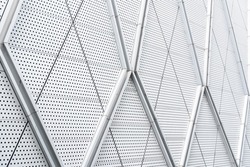 aluminium composite panels or cladding with perforated sheets on modern building facade, Abstract architecture background concept.