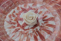 Iberian ham dish and rose