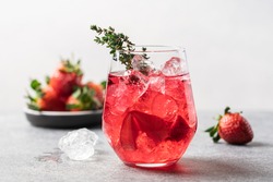 Berry drink with crushed ice and thyme. Strawberry and blueberry lemonade. Summer refreshing drink