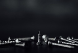 Closeup shot of nails, drill screws