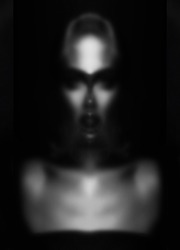Abstract, fine art, sci-fi concept. Abstract and futuristic looking alien or extraterrestrial portrait. Black and white image. Defocused, out of focus and blurred image. Image contain noise and grain