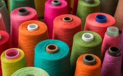 Colorful yarn on spool, yarn on tube, cotton, wool, linen thread
