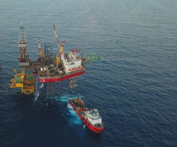 Aerial view of a offshore platform. Also known as an oil platform or offshore drilling rig is facilities to explore and process petroleum and natural gas.
