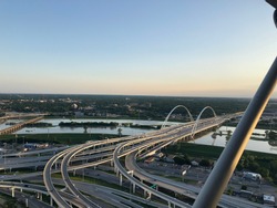 The sunset over the  Margaret McDermott Bridge and Trinity River in Dallas, Texas as seen from Reunion Tower.