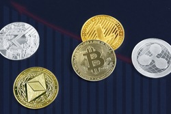 Various cryptocurrency coins on blue background. Cryptocurrency, virtual money. Virtual digital currency