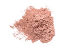 Dry red cosmetic clay isolated on white background. Heap of pink cosmetic clay.