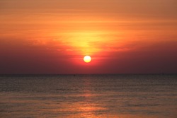 Full sun with sunset sky, sunset today and sunset tonight, sunset saturday in the Chaolao Beach Chanthaburi Thailand.
