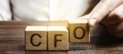 A man makes the word acronym abbreviation CFO. Chief Financial Officer. Financial management in business and company. Risk. Development and growth. Appointment to a new post, promotion.