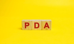 Wooden blocks with the word PDA. Personal Digital Assistant acronym concept. Technology, business and finance