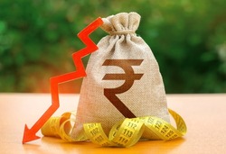 Indian rupee money bag with down arrow and measure tape. Reduced wages, cuts in social benefits. Cutting costs, saving. Capital outflow. Decrease in discount rate by national bank. Falling wages