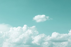 clear turquoise sky with simple white cloud with space for text background.