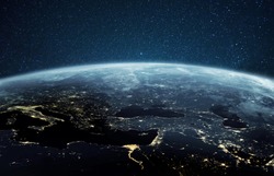 Beautiful planet earth with night city lights. Europe and Africa at night viewed from space with city lights showing human activity in Germany, Poland, Italy, Egypt, Greece and other countries.