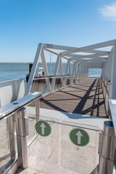 Metal modern entrance to the pier near a sea in Lisbon, Portugal