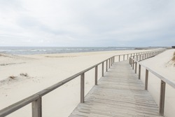 Beautiful Wooden Walkway on the Beach along the Ocean