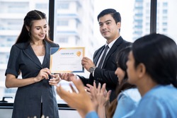 Business executives congratulate employees on their excellent work, Certificate of Excellence or a Certificate for Success in Work, Business people teamwork.