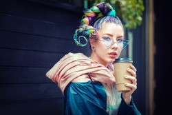 Cool funky young girl with piercing and crazy hair enjoy takeaway coffee on street – Hipster woman with trendy colorful avant-garde look and modern sunglasses having fun outdoor