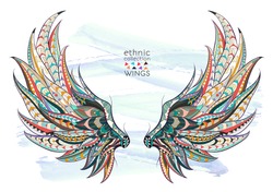 Patterned wings on the grunge background. African / indian / totem / tattoo design. It may be used for design of a t-shirt, bag, postcard, a poster and so on.  