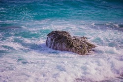 Sea foam, rock and waves, ocean scenery on paradise island, Philippines