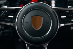 Modern car steering wheel close up