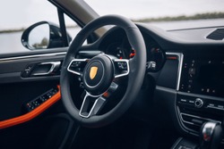 Modern car steering wheel and dashboard panel