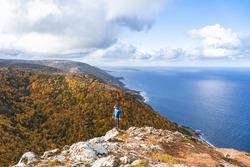 Man hiking Blueberry Mountain, Cape Breton Island, Nova Scotia, Canada