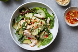 Thai style chicken salad with cucumber and peanuts