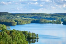 Summer view from the Neitvuori mountain in Finland to the lake and forest.