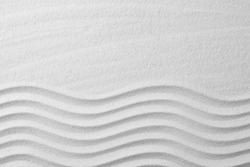 Zen garden pattern on sand as background, top view with space for text. Meditation and harmony