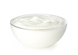 Glass bowl with creamy yogurt on white background