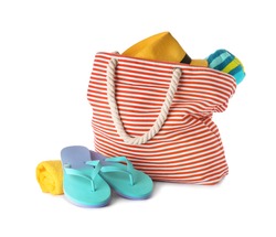 Composition with bag and beach accessories on white background