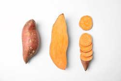 Composition with sweet potatoes on white background, top view