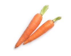 Fresh ripe carrots on white background, top view