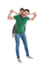 Portrait of dad playing with his son isolated on white