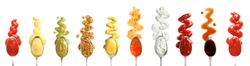 Set of spoons with different delicious sauces on white background, top view