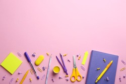 Bright school stationery on pink background, flat lay. Space for text