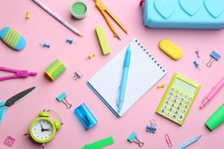 Bright school stationery on pink background, flat lay