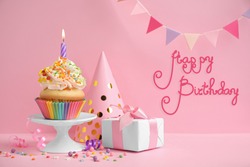 Composition with delicious cupcake on pink background. Happy Birthday