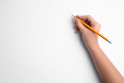 Woman holding pencil on white background, top view